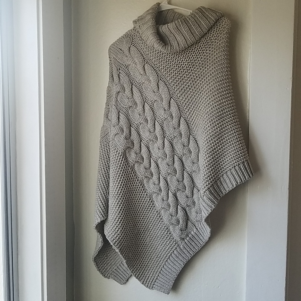 Warm knitted turtleneck poncho